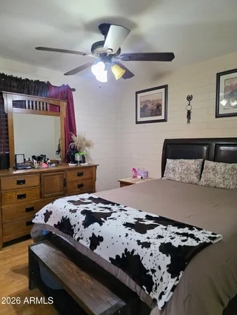 a bedroom with a bed and a dresser
