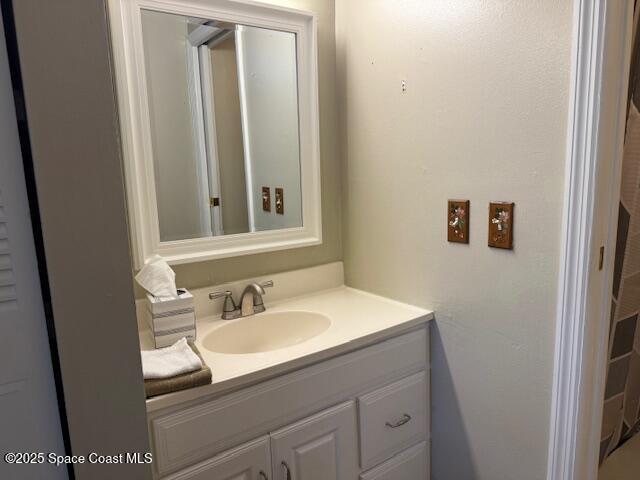 2727 North Wickham Road, Unit 20510 Melbourne, FL 32935 - Photo 15 of 25 a bathroom with a sink and a mirror
