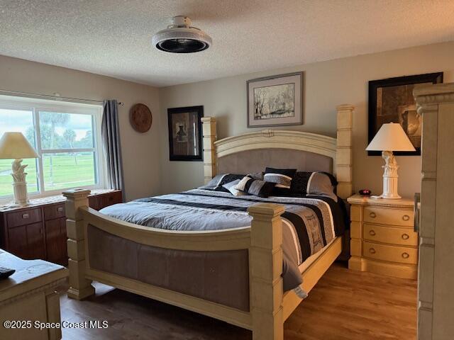 2727 North Wickham Road, Unit 20510 Melbourne, FL 32935 - Photo 17 of 25 a bedroom with a bed and window