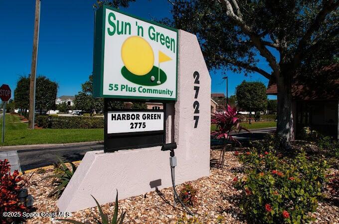 2727 North Wickham Road, Unit 20510 Melbourne, FL 32935 - Photo 25 of 25 a sign on the side of the road