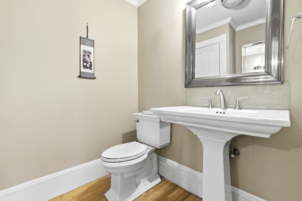 17 Wellesley Street Weston, MA 02493 - Photo 17 of 30 a bathroom with a sink a toilet and mirror
