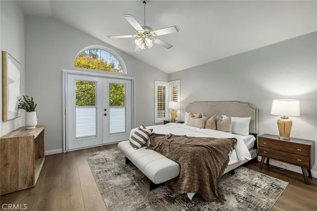 a view of a deck with two chairs and a potted plant
