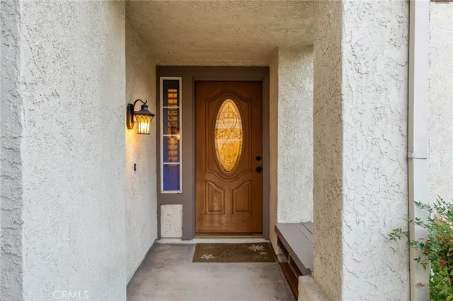 a view of a entryway door front of a house
