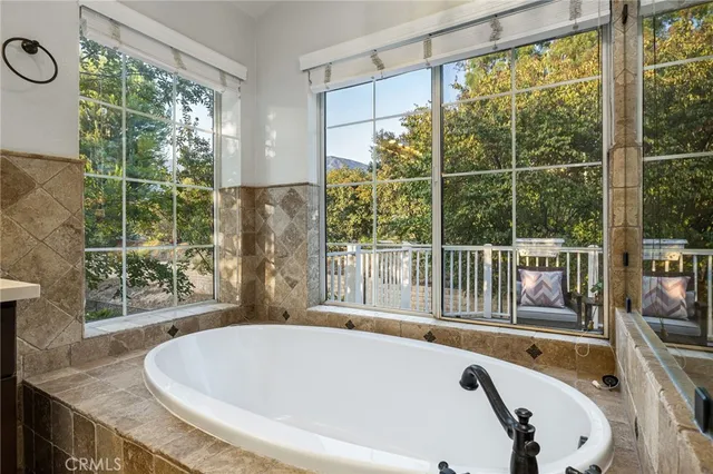 a bathroom with a toilet a sink and a mirror