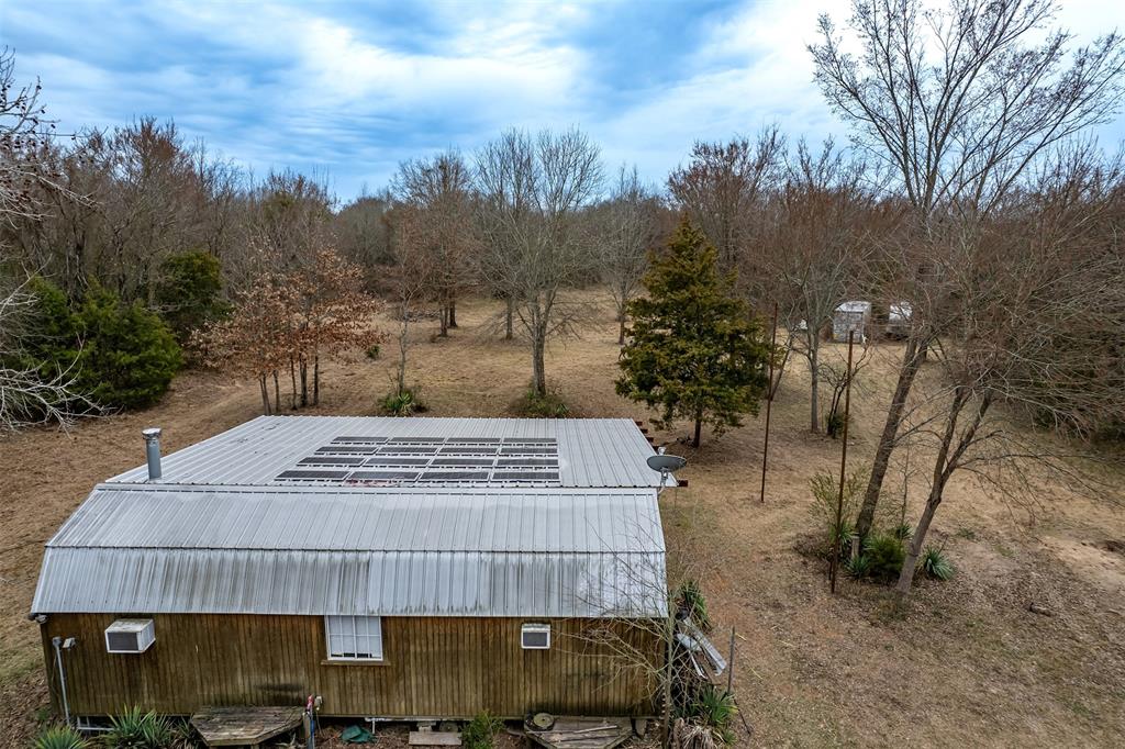 139 Northwest County Road, Unit 1061 Talco, TX 75487 - Photo 8 of 39 a view of a yard in front of the house
