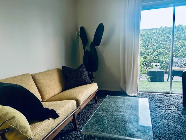 a living room with furniture and a rug