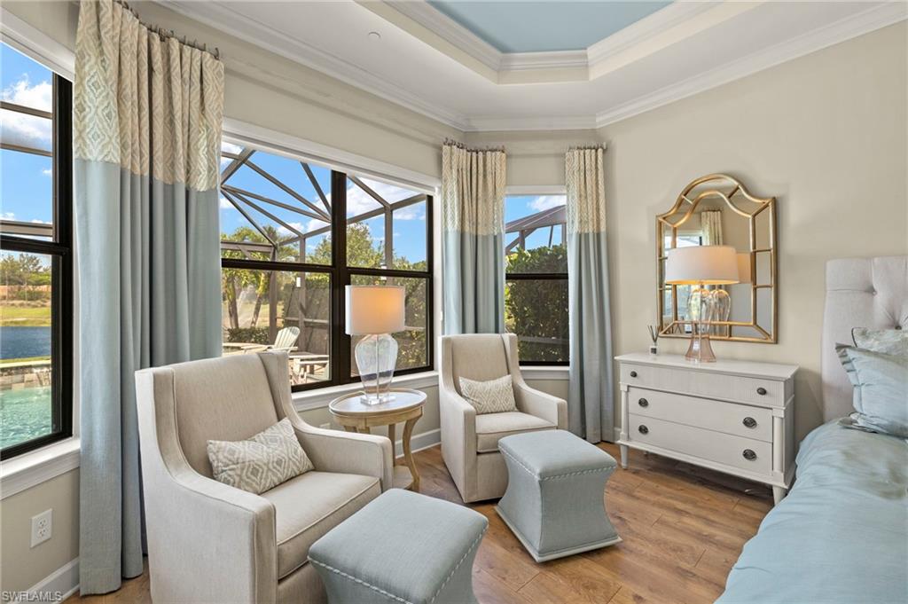 10234 Coconut Road Estero, FL 34135 - Photo 18 of 36 a living room with furniture and a large window