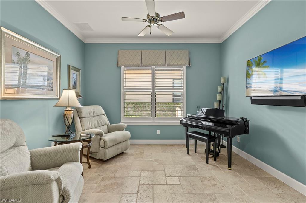 10234 Coconut Road Estero, FL 34135 - Photo 26 of 36 a living room with furniture and a window