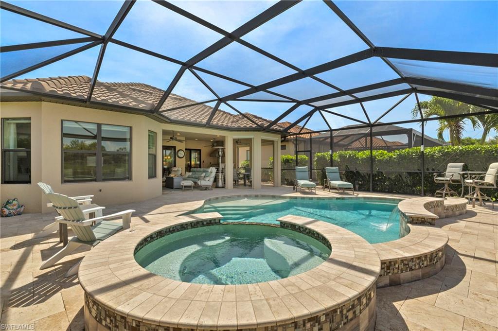 10234 Coconut Road Estero, FL 34135 - Photo 35 of 36 a swimming pool with outdoor seating yard and outdoor seating