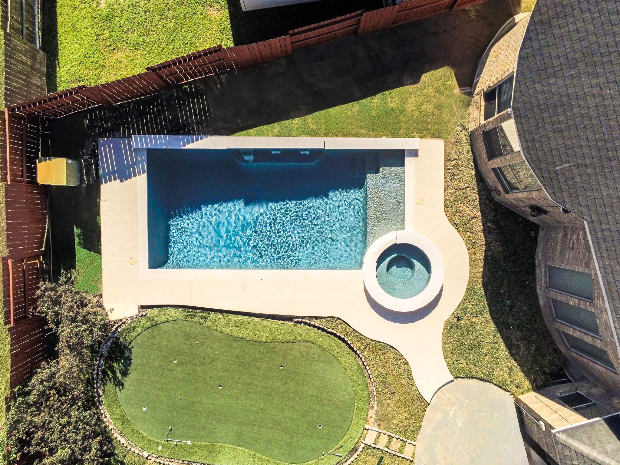 6506 Monte Bello Ridge Lane Houston, TX 77041 - Photo 2 of 39 Discover your personal oasis with this stunning, newly built pool, seamlessly integrated into a beautifully designed backyard retreat featuring a charming putting green.
