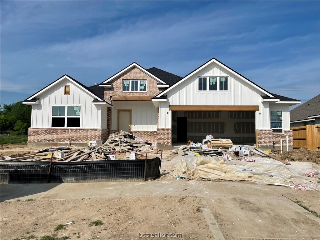 a view of a house with swimming pool and sitting area