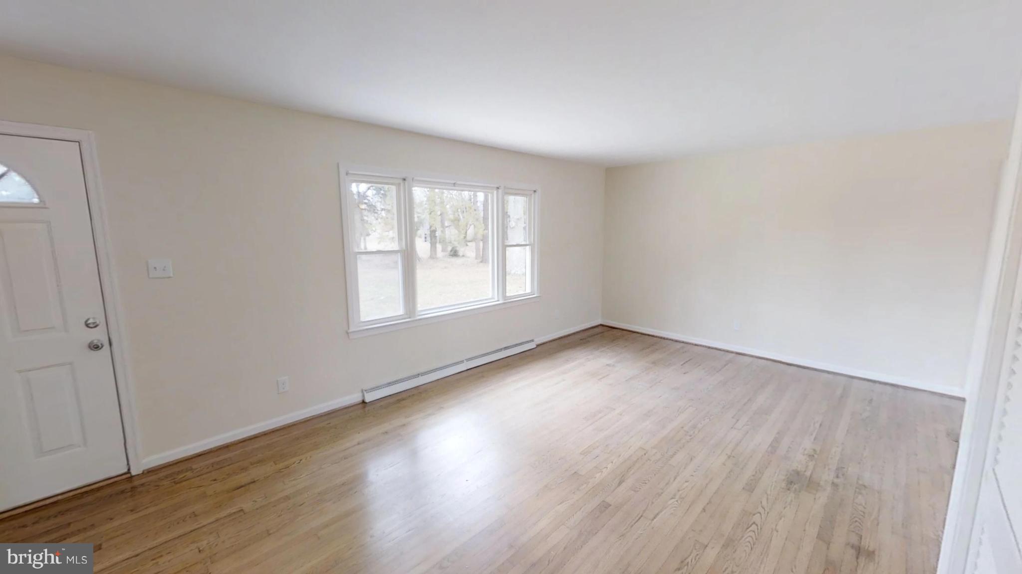 21410 Springfield Road Bushwood, MD 20618 - Photo 13 of 47 Living room looking from the hallway.
