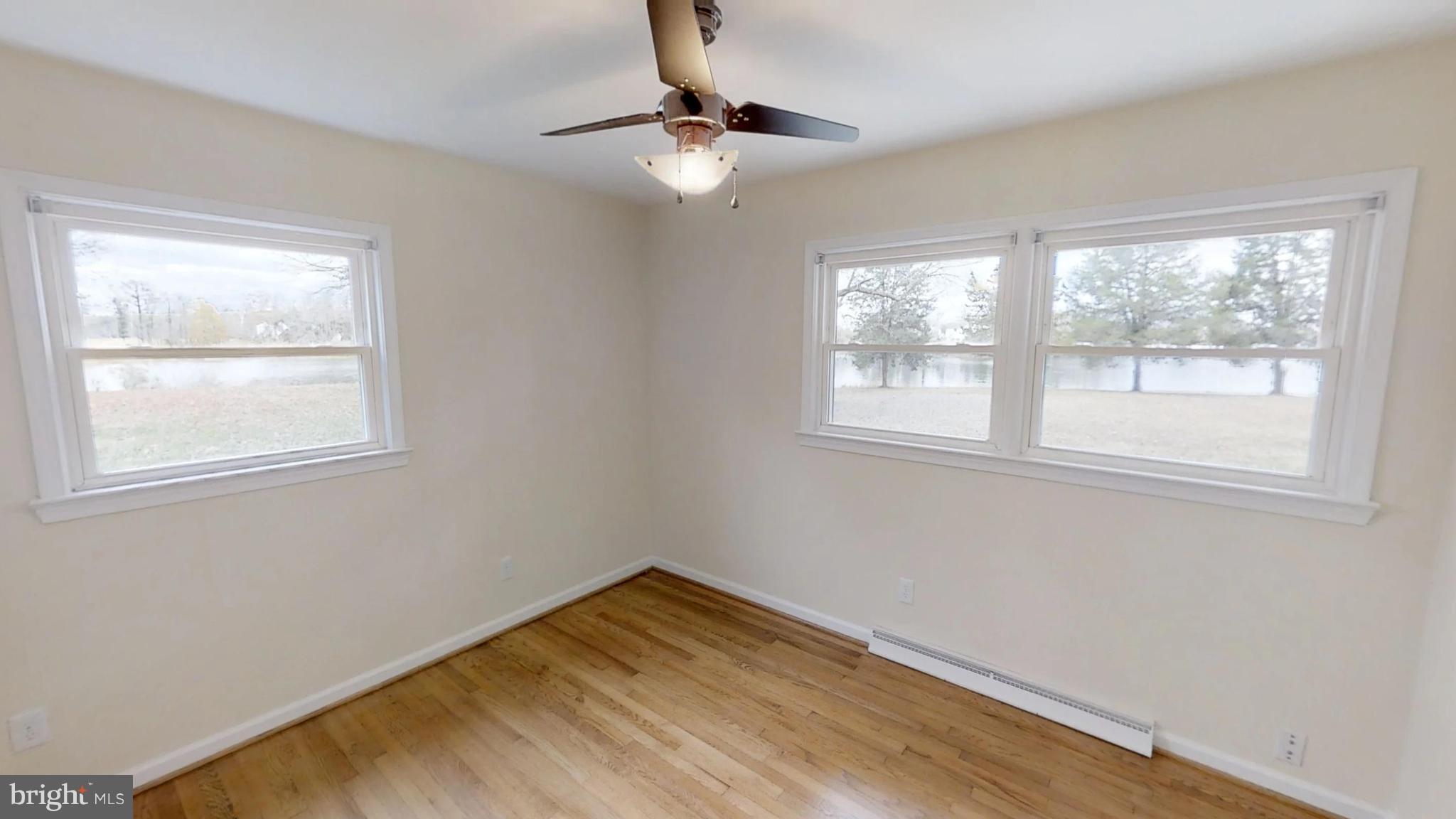 21410 Springfield Road Bushwood, MD 20618 - Photo 23 of 47 Front bedroom hardwood floors