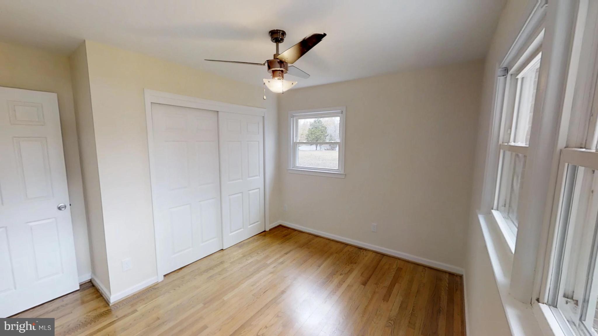 21410 Springfield Road Bushwood, MD 20618 - Photo 24 of 47 Back bedroom hardwood floors