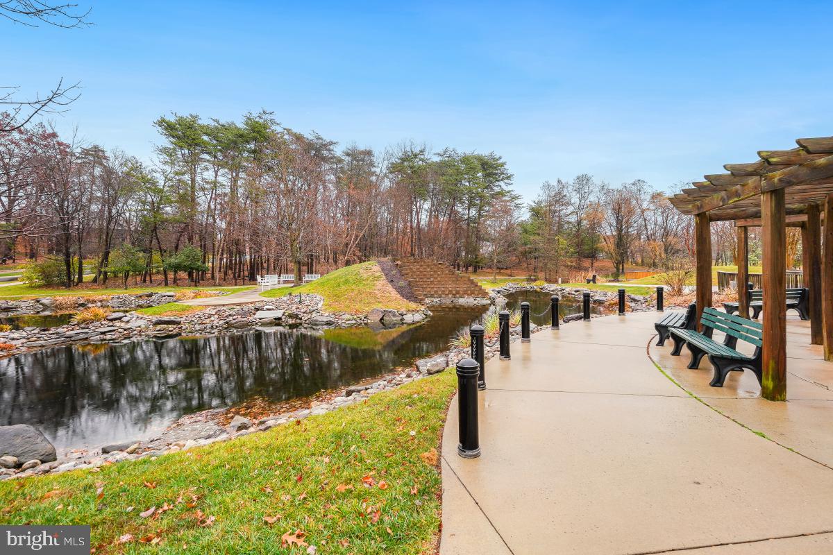 3100 North Leisure World Boulevard, Unit 603 Silver Spring, MD 20906 - Photo 31 of 49 a view of a swimming pool with a patio