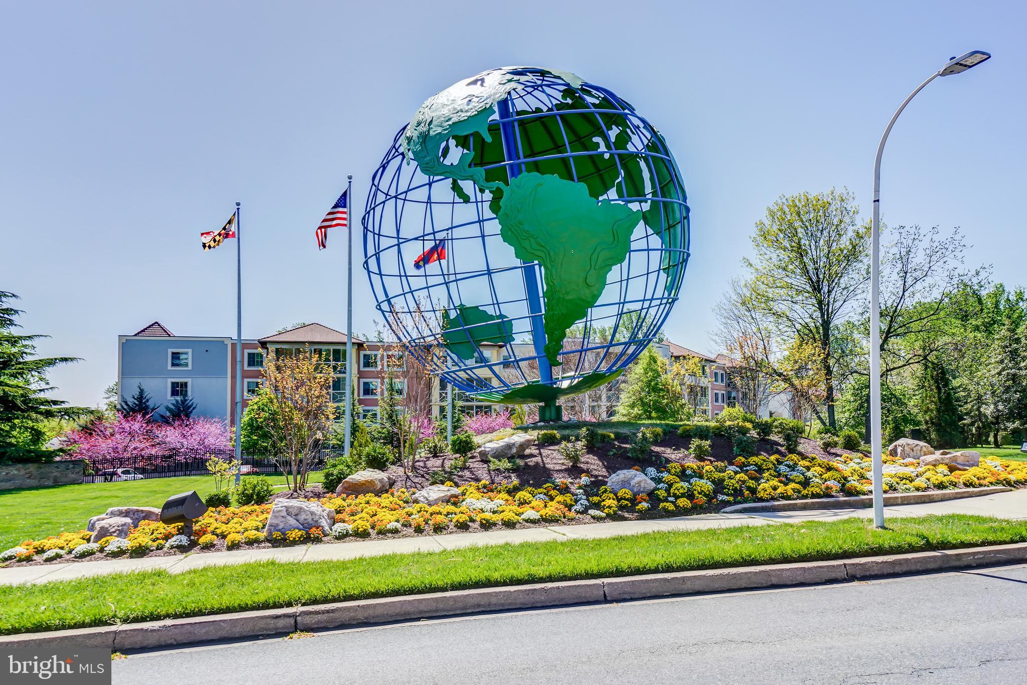 3100 North Leisure World Boulevard, Unit 603 Silver Spring, MD 20906 - Photo 49 of 49 a view of yellow house with a big yard and potted plants
