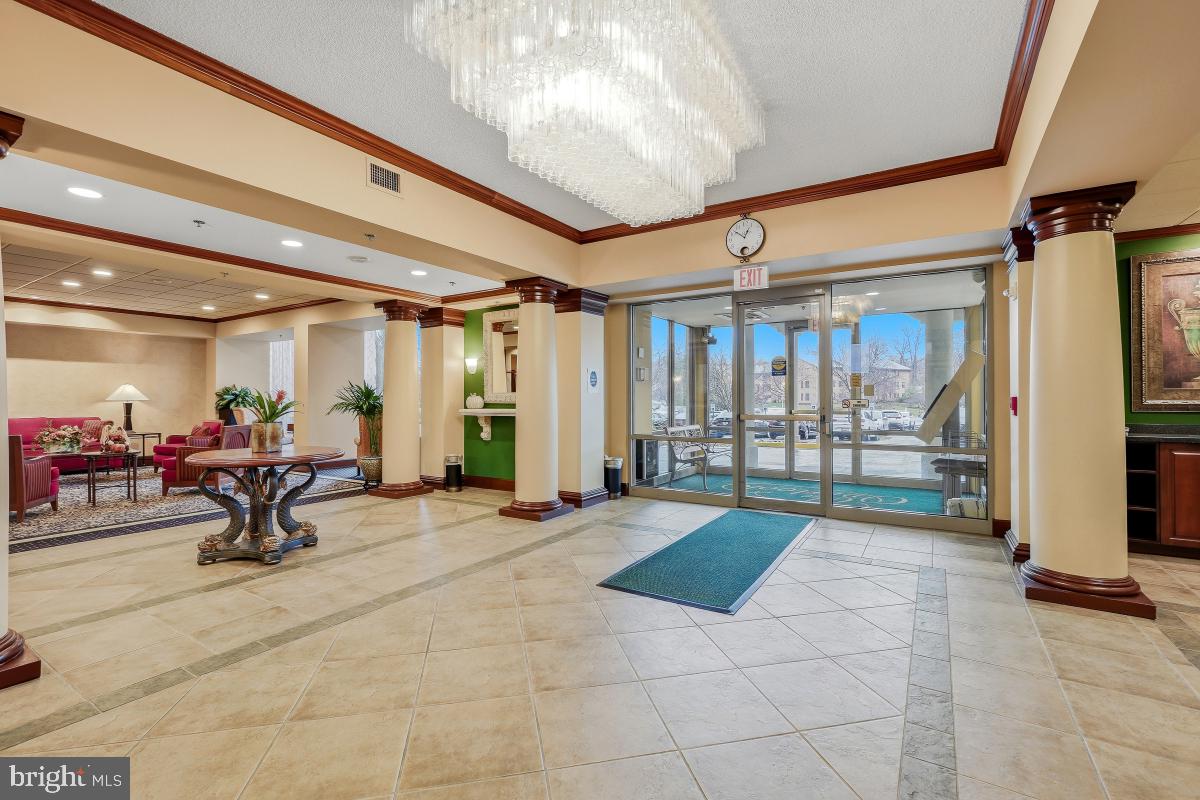 3100 North Leisure World Boulevard, Unit 603 Silver Spring, MD 20906 - Photo 5 of 49 a living room with furniture and a table