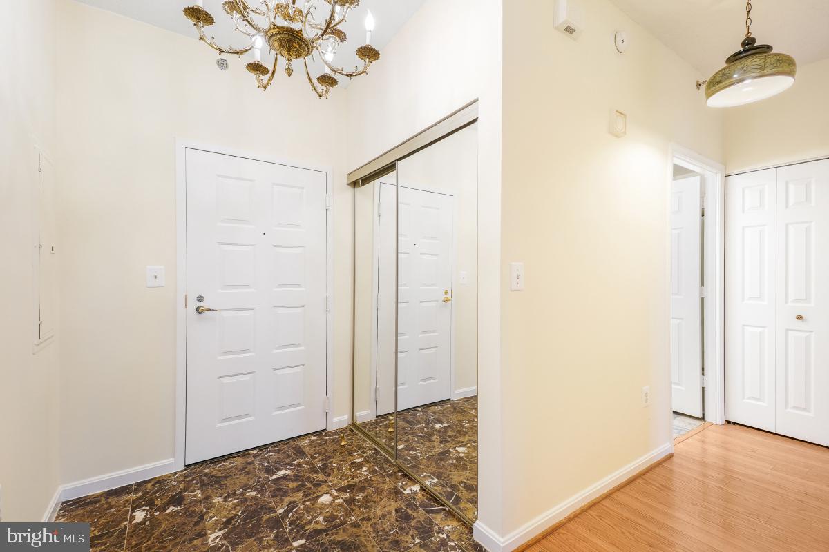 3100 North Leisure World Boulevard, Unit 603 Silver Spring, MD 20906 - Photo 9 of 49 a view of a hallway to a bedroom