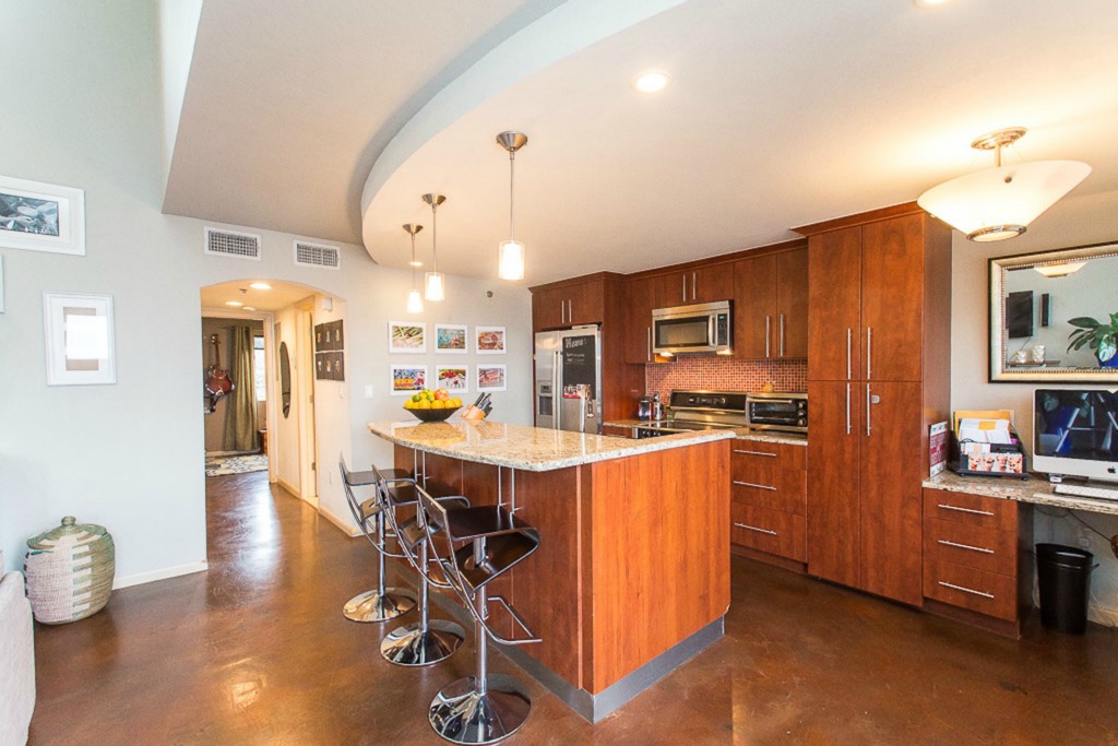 41 Waller Street, Unit 308 Austin, TX 78702 - Photo 15 of 34 a large kitchen with a table and chairs