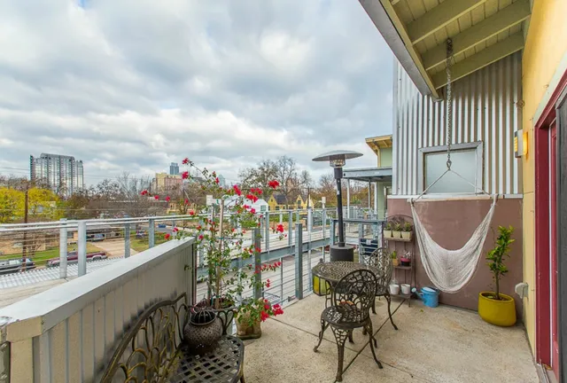 a view of a backyard with sitting area