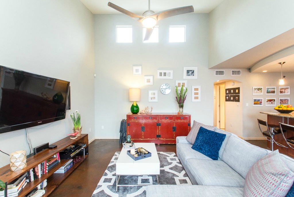 41 Waller Street, Unit 308 Austin, TX 78702 - Photo 6 of 34 a living room with furniture and a flat screen tv