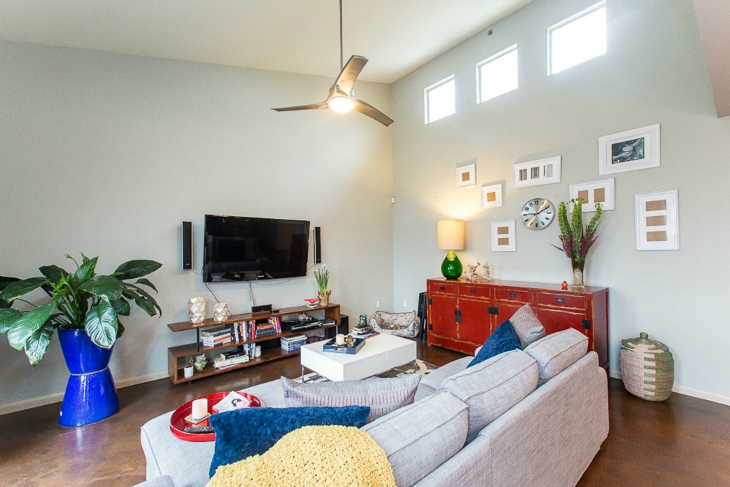 41 Waller Street, Unit 308 Austin, TX 78702 - Photo 9 of 34 a living room with furniture and a flat screen tv