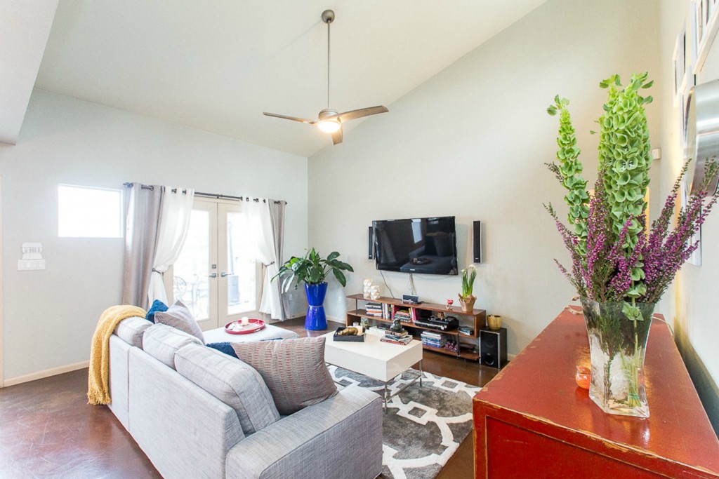 41 Waller Street, Unit 308 Austin, TX 78702 - Photo 10 of 34 a living room with furniture and a flat screen tv