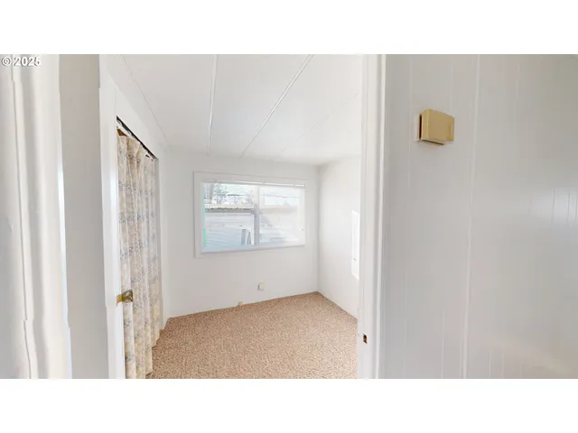 a open space with a sink and a mirror