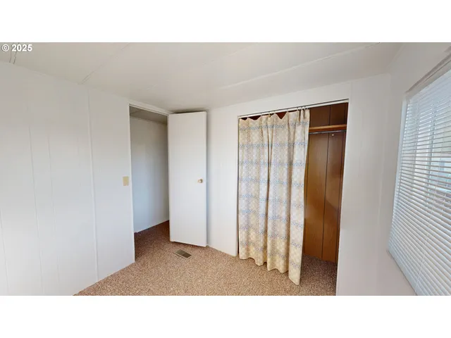 a open space with windows and closet