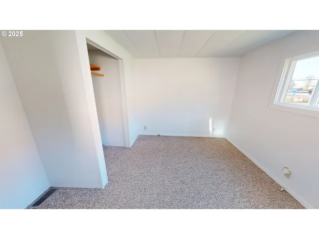 a view of a yard with a tree