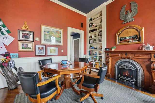 a living room with furniture a fireplace and a table