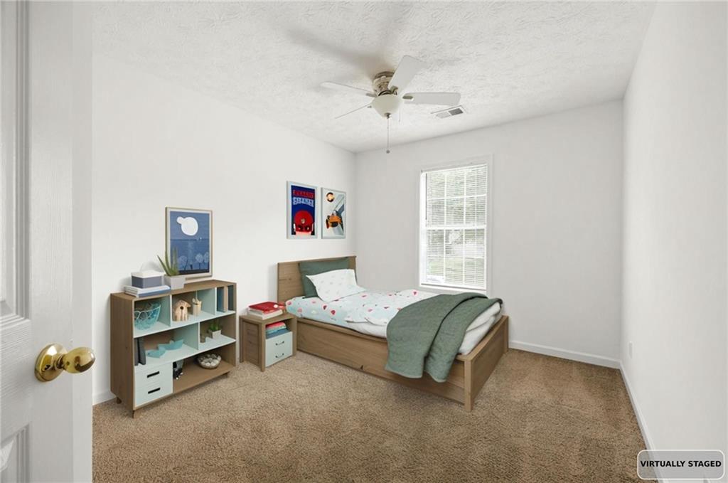 1093 Athena Court Acworth, GA 30101 - Photo 18 of 27 a living room with furniture and a window