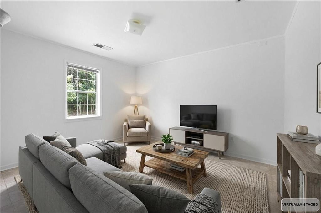 1093 Athena Court Acworth, GA 30101 - Photo 21 of 27 a living room with furniture and a flat screen tv