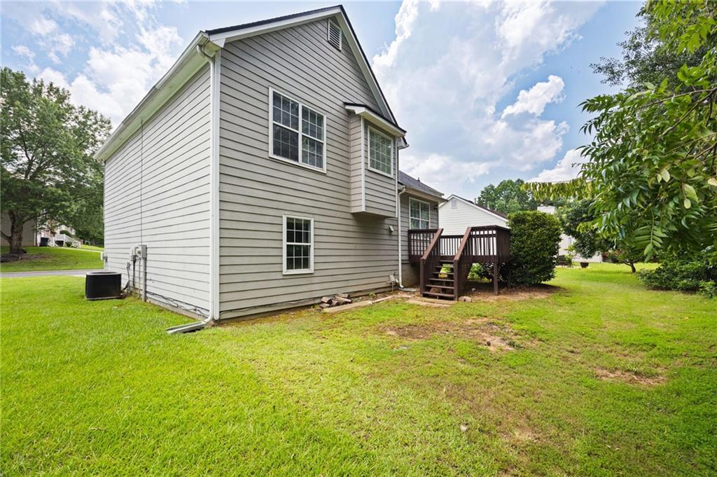 1093 Athena Court Acworth, GA 30101 - Photo 26 of 27 a view of a house with a yard
