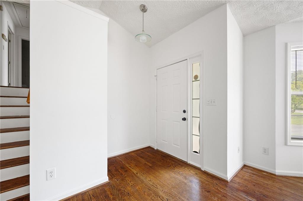 1093 Athena Court Acworth, GA 30101 - Photo 5 of 27 a view of empty room with wooden floor
