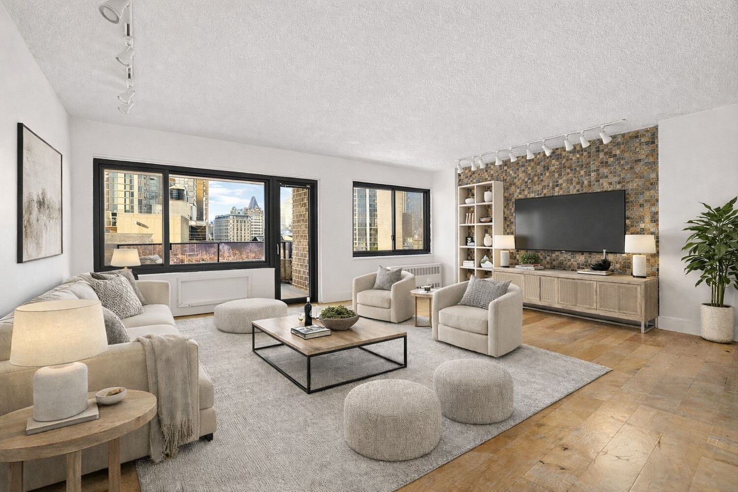 90 Gold Street, Unit 13L Manhattan, NY 10038 - Photo 1 of 10 a living room with furniture and a flat screen tv