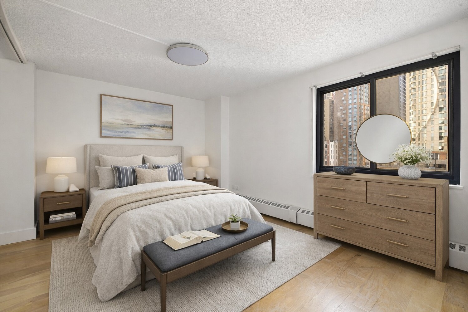 90 Gold Street, Unit 13L Manhattan, NY 10038 - Photo 7 of 10 a bedroom with a bed and a dresser