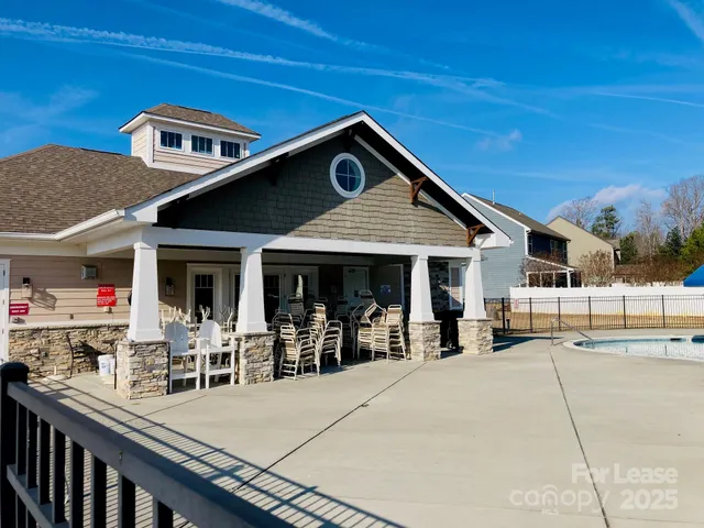 a view of a swimming pool with a yard