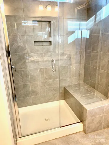 a bathroom with a bathtub and a shower