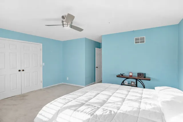 a bathroom with a sink a toilet and shower curtain