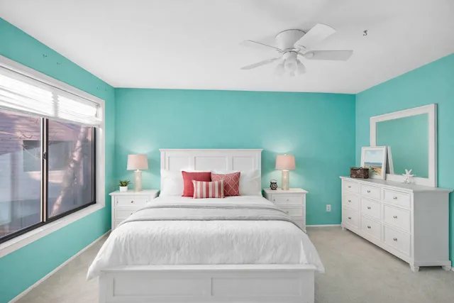 a bedroom with a bed and a book shelf