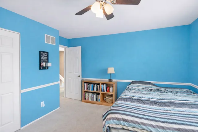 a bedroom with a bed and furniture