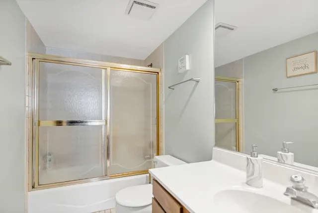 a bedroom with furniture and window