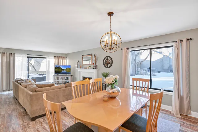 a kitchen with white cabinets and appliances