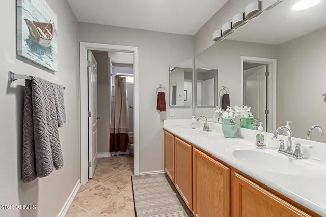 a bathroom with a glass shower door