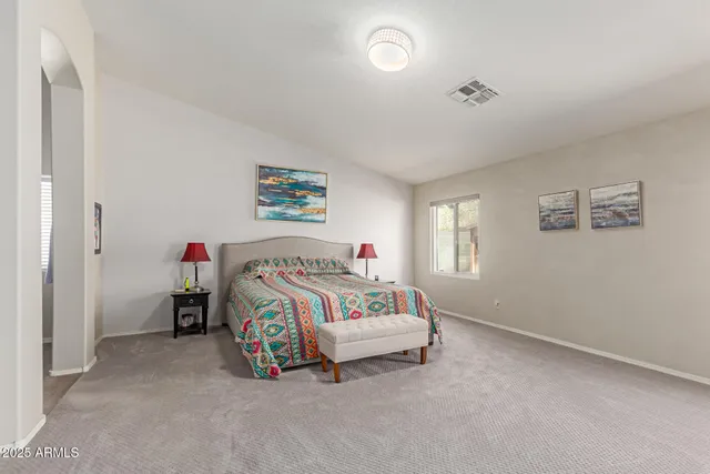a kitchen with kitchen island granite countertop wooden cabinets and stainless steel appliances
