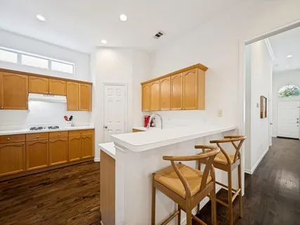 a spacious bathroom with a sink a mirror and a bathtub