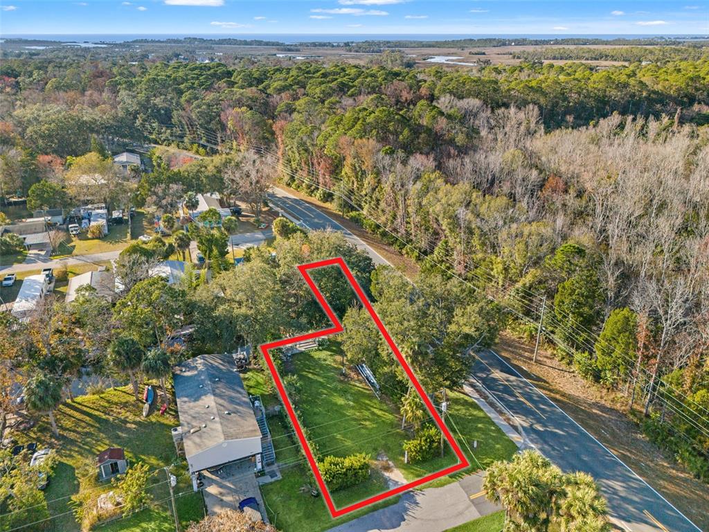 7287 Coventry Court Weeki Wachee, FL 34607 - Photo 15 of 16 a view of a yard with a lake