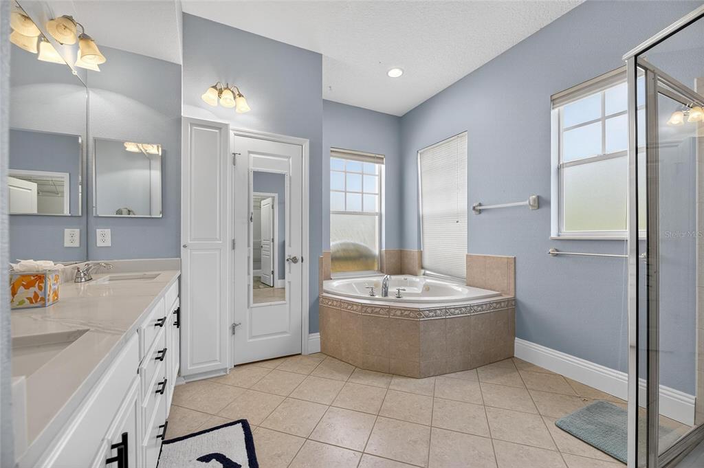 5720 Tortoise Place Apollo Beach, FL 33572 - Photo 32 of 83 a spacious bathroom with a tub sink and mirror