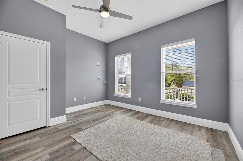 5720 Tortoise Place Apollo Beach, FL 33572 - Photo 43 of 83 a view of an empty room with a window and wooden floor